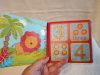 Színes, újszerű állapotban lévő pancsikönyv – Numbers in the Jungle 13×13 cm (G4)